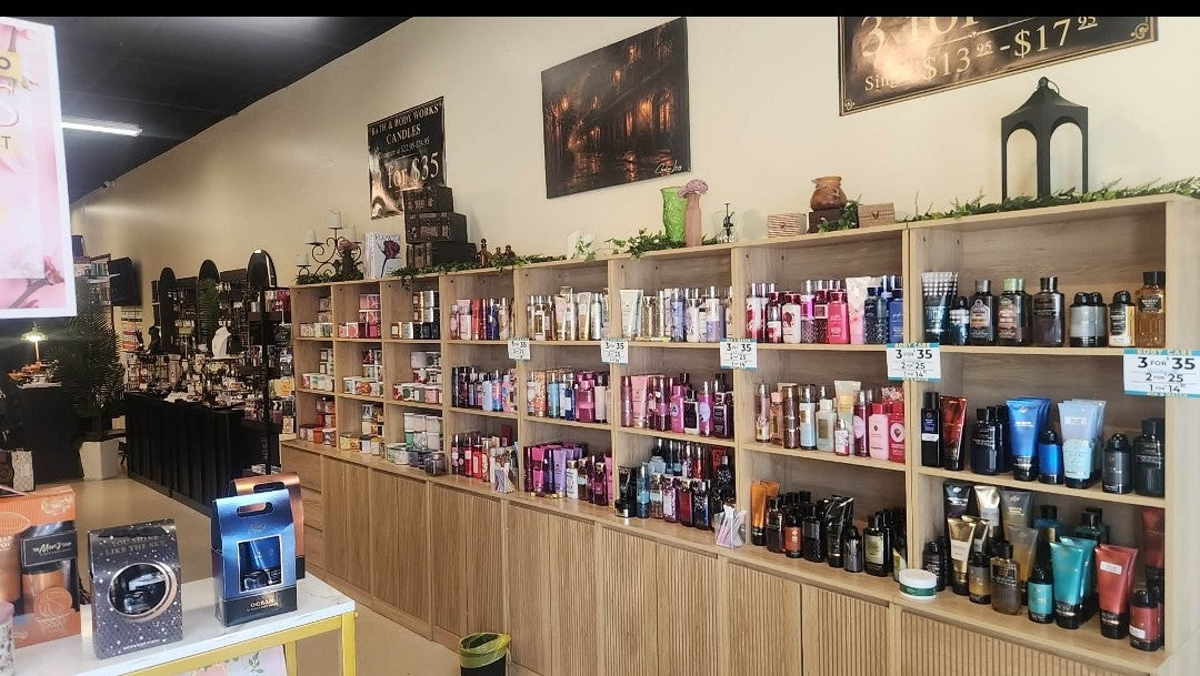LEDTY Luxe Outlet store interior displaying a variety of fragrances, body care, beauty products, and personal care items on shelves.