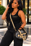 LEDTY model wearing black and gold football helmet clear crossbody handbag